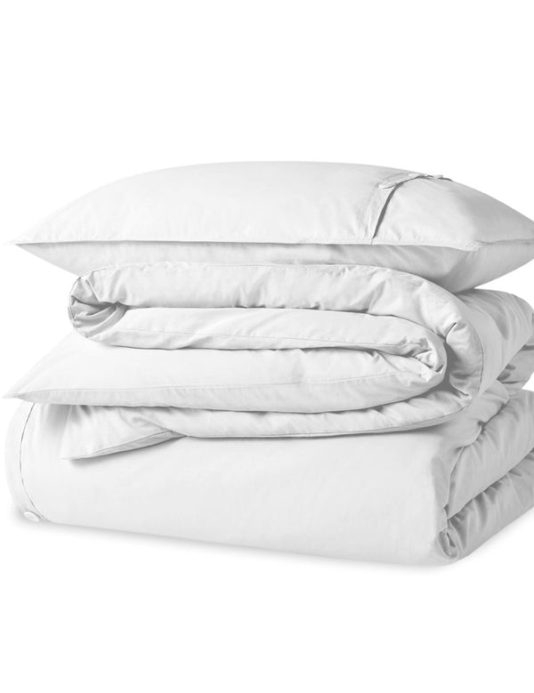 A percale duvet set folded and stacked