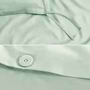 Close-up of a sateen duvet cover with a button and ties