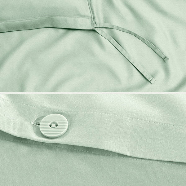 Close-up of a sateen duvet cover with a button and ties