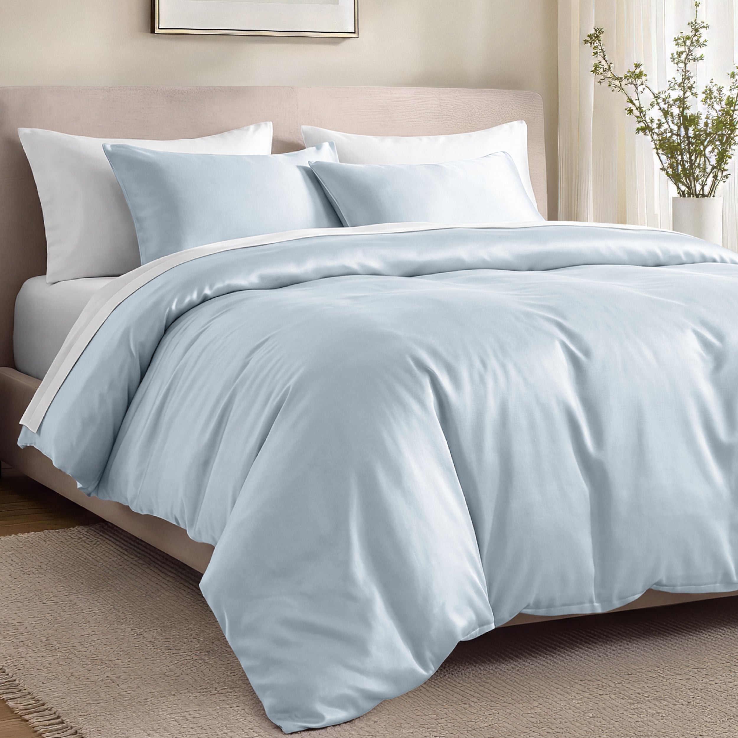 Bed with organic cotton sateen bedding in a bedroom setting.