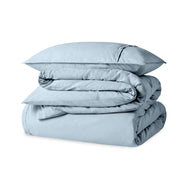 A percale duvet set folded and stacked