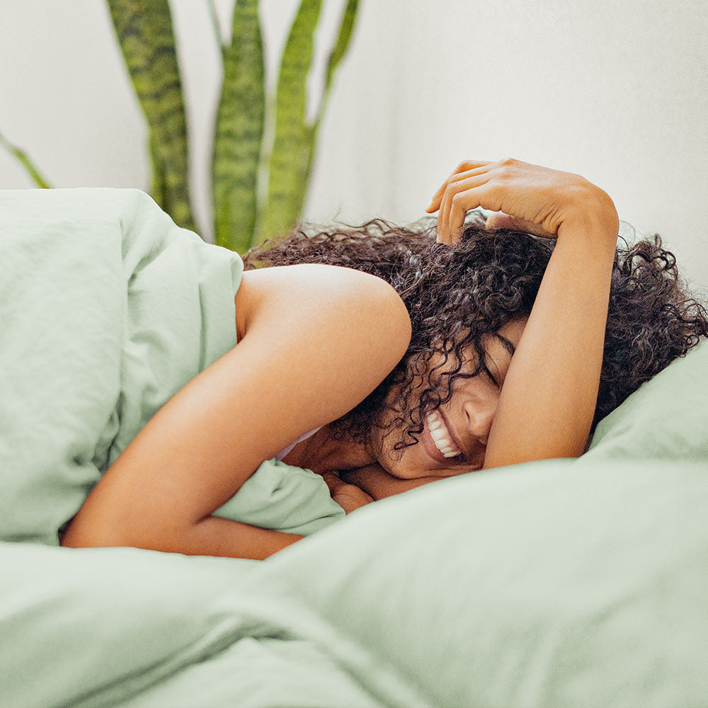 Woman Laying on quality Mint Green Sheets