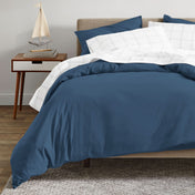 A modern bed with an organic sateen duvet cover set on.