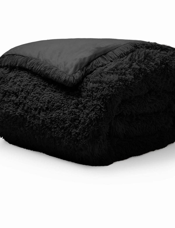 A black shaggy duvet cover folded neatly