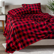 A modern bed with plaid microfiber sheet set on.