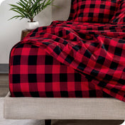 Close up of a plaid sheet set on a mattress