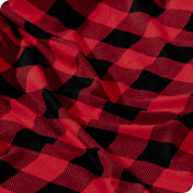 Close up of the print and texture of the red and black plaid microfiber sheets