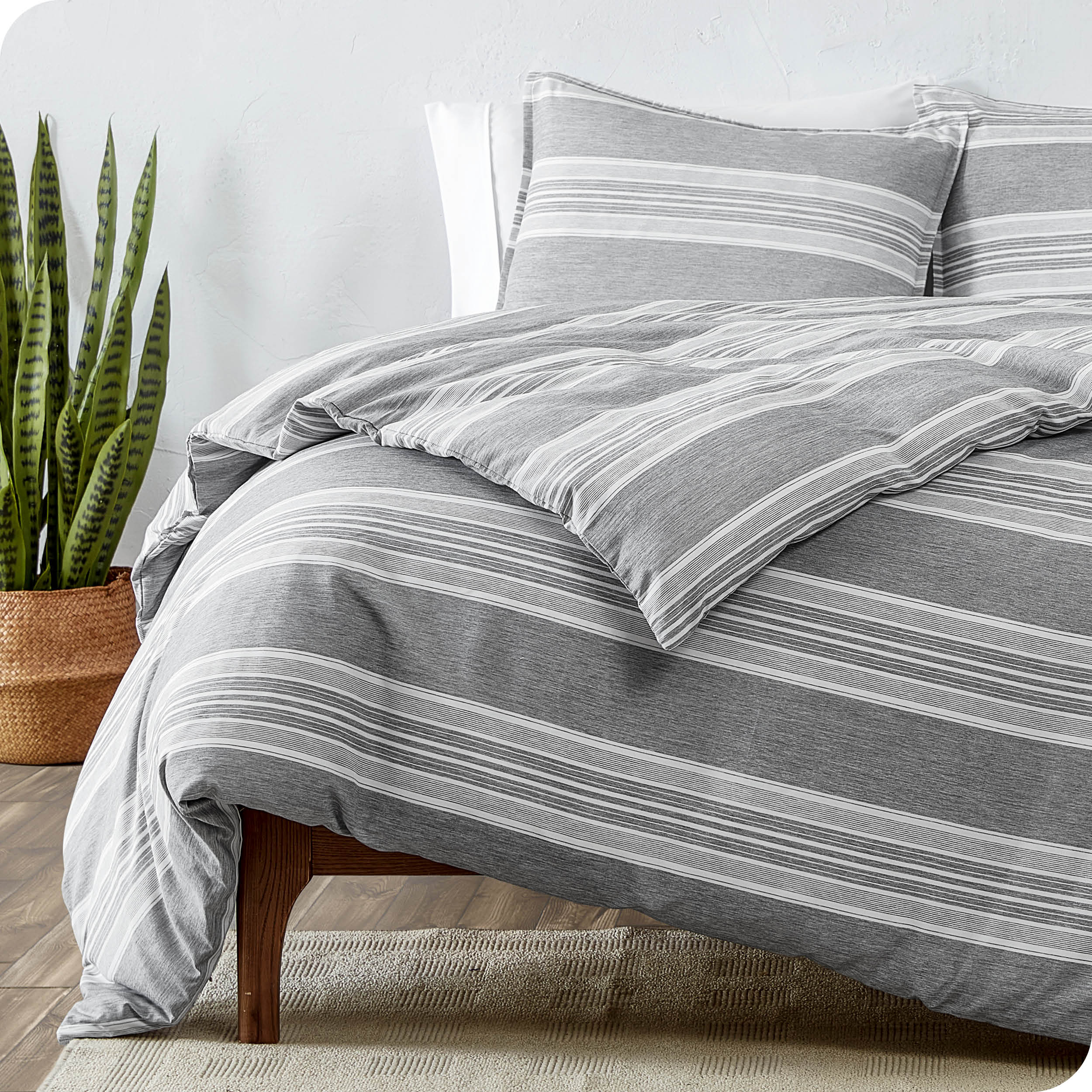 A modern bed with a printed microfiber duvet cover and sham set.