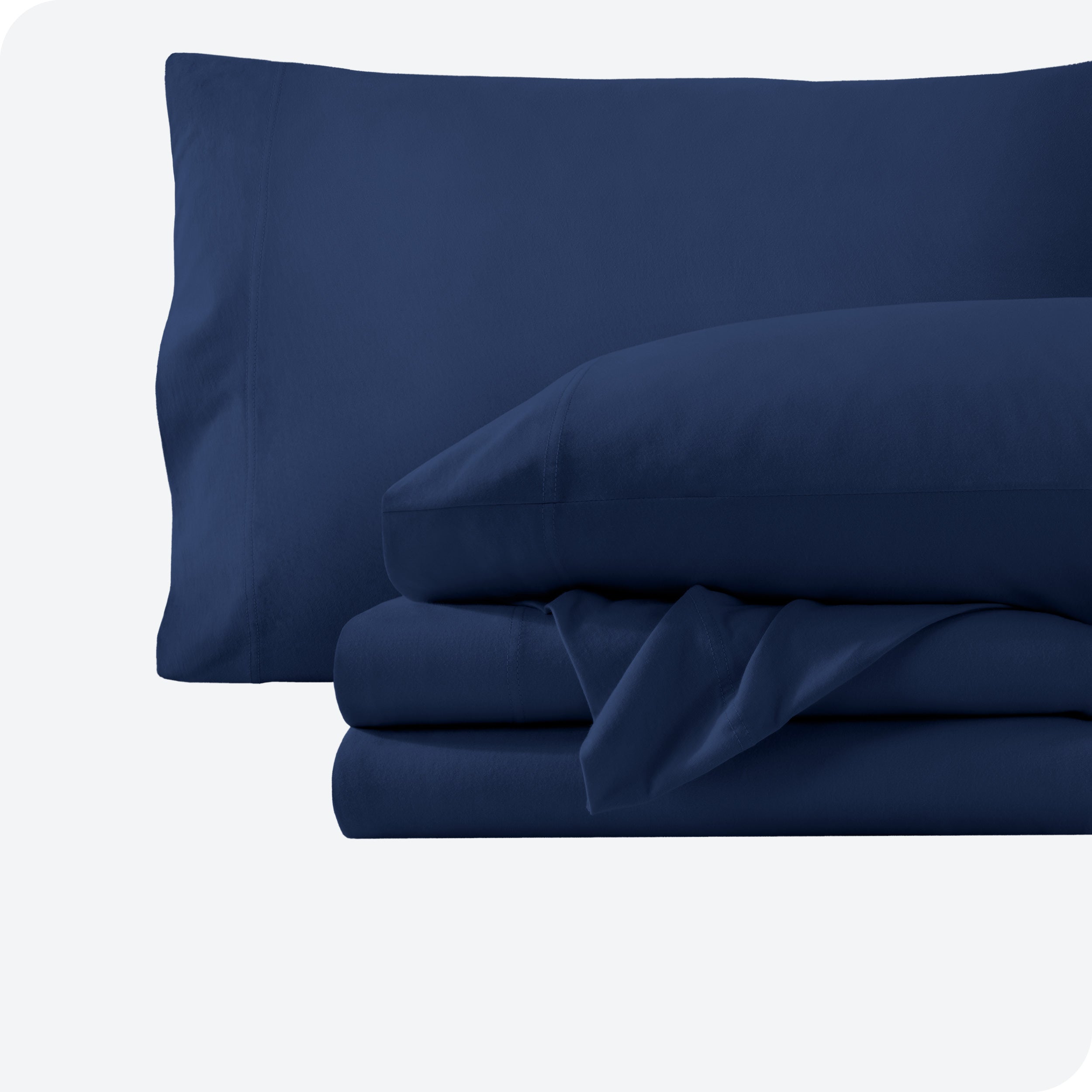 A dark blue sheet set folded and stacked