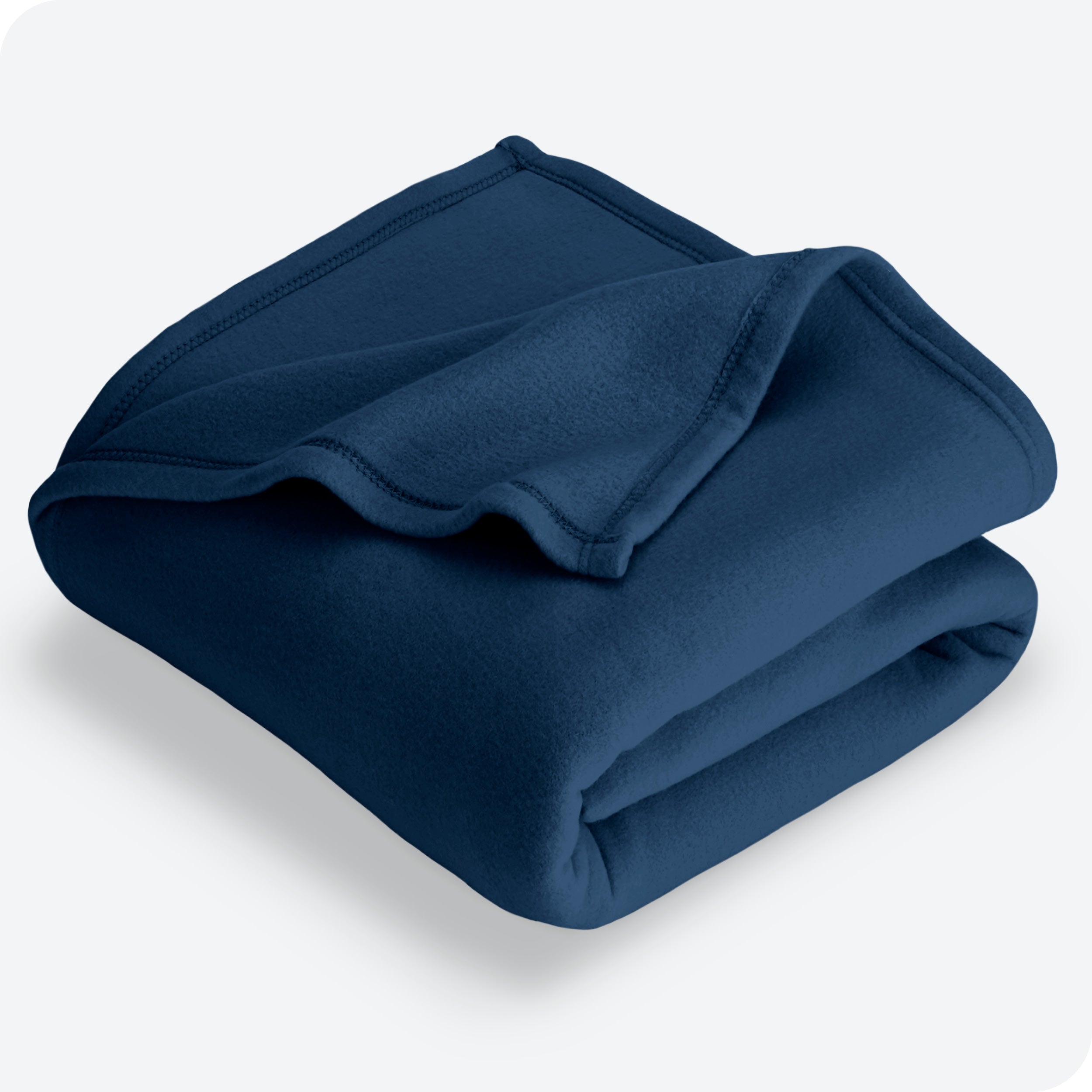Dark blue polar fleece blanket folded with 1 corner folded back