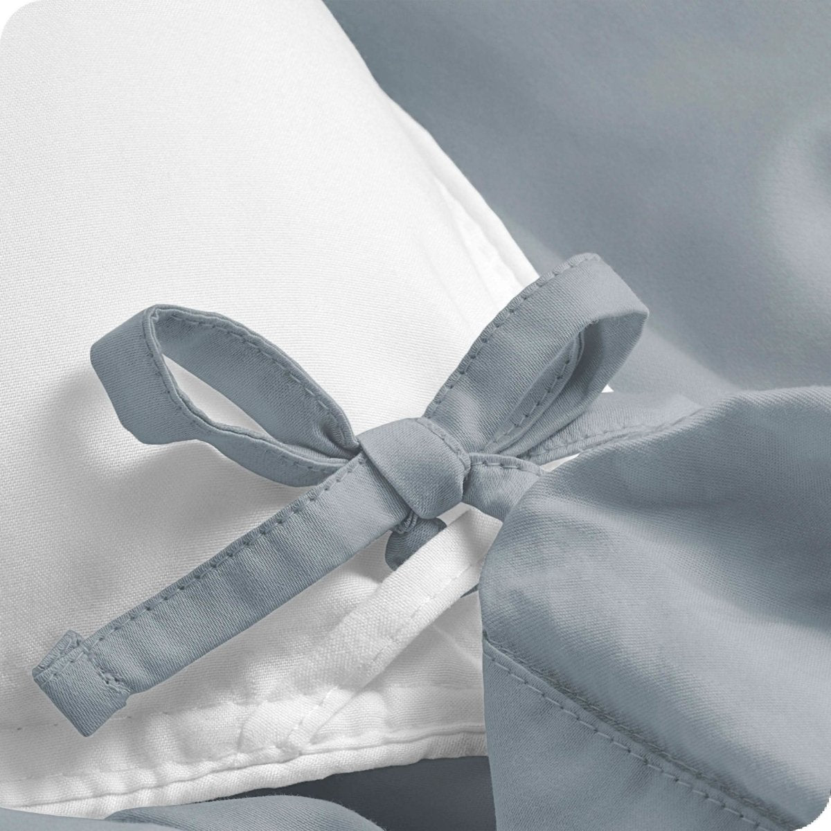 Close up of ties on a percale duvet cover