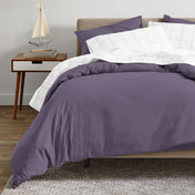 A modern bed with an organic sateen duvet cover set on.