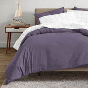A modern bed with an organic sateen duvet cover set on.