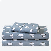 Flannel print sheet set folded and stacked neatly on a white background