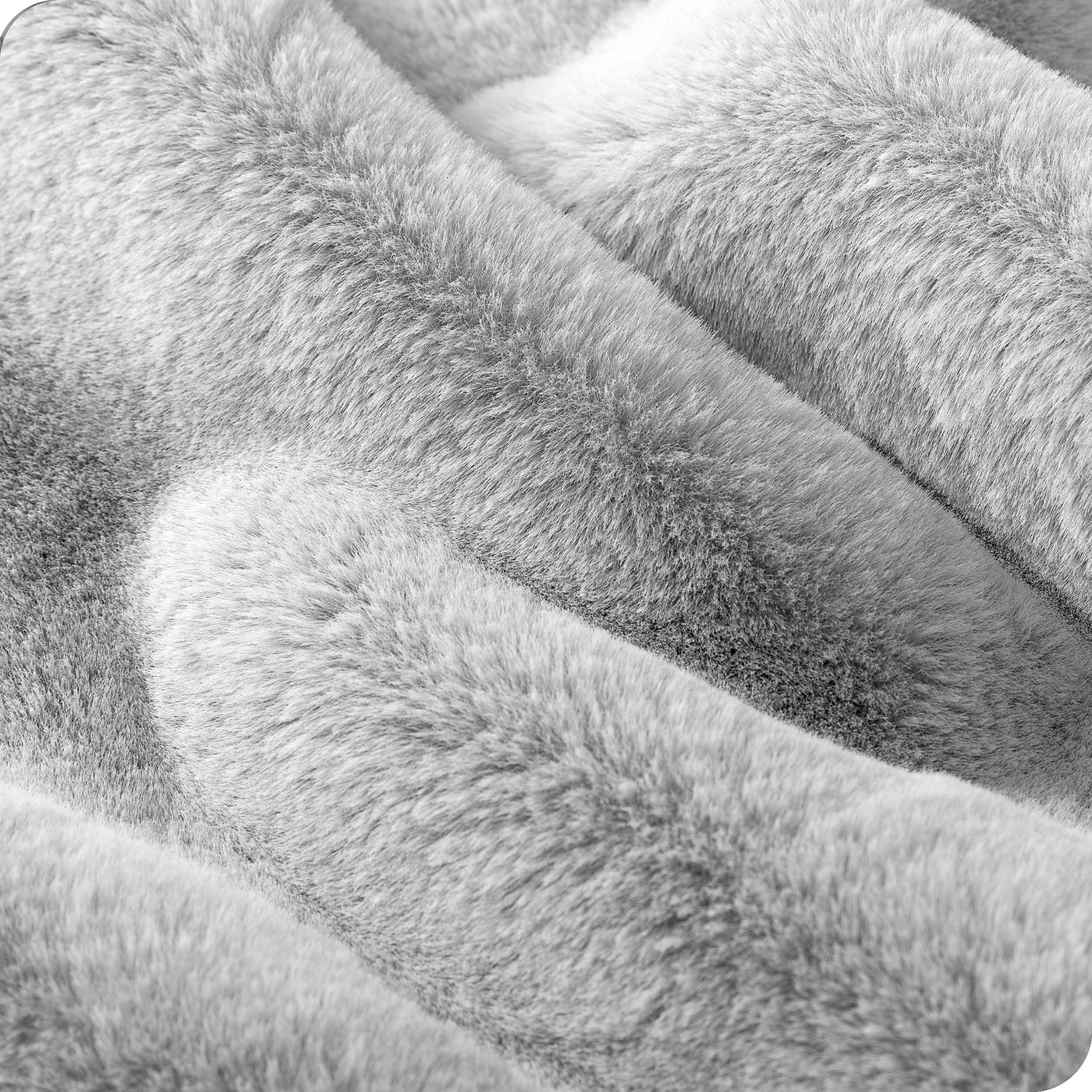 Close up showing the texture of faux fur blanket