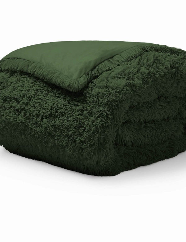 A forest green shaggy duvet cover folded neatly