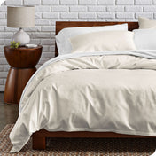 Percale duvet cover set on a bed in a modern bedroom