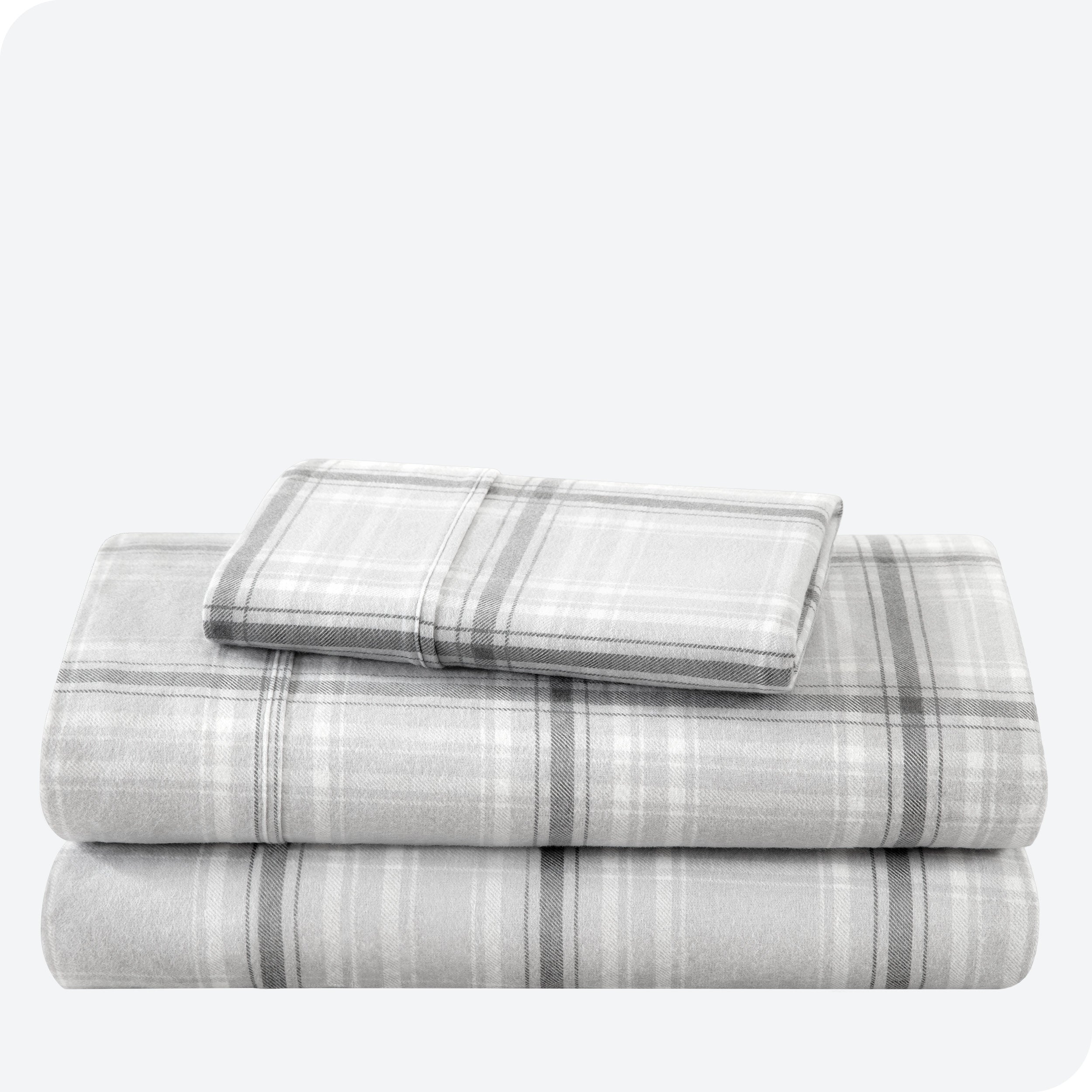 Flannel print sheet set folded and stacked neatly on a white background