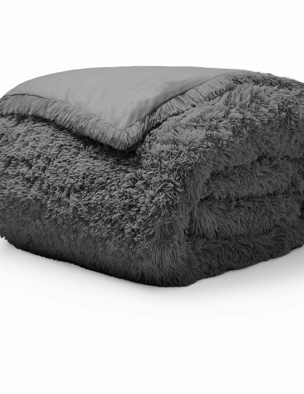 A grey shaggy duvet cover folded neatly