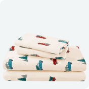 Flannel print sheet set folded and stacked neatly on a white background