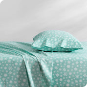 A sideview of a bed with one pillow in our printed microfiber sheet set.