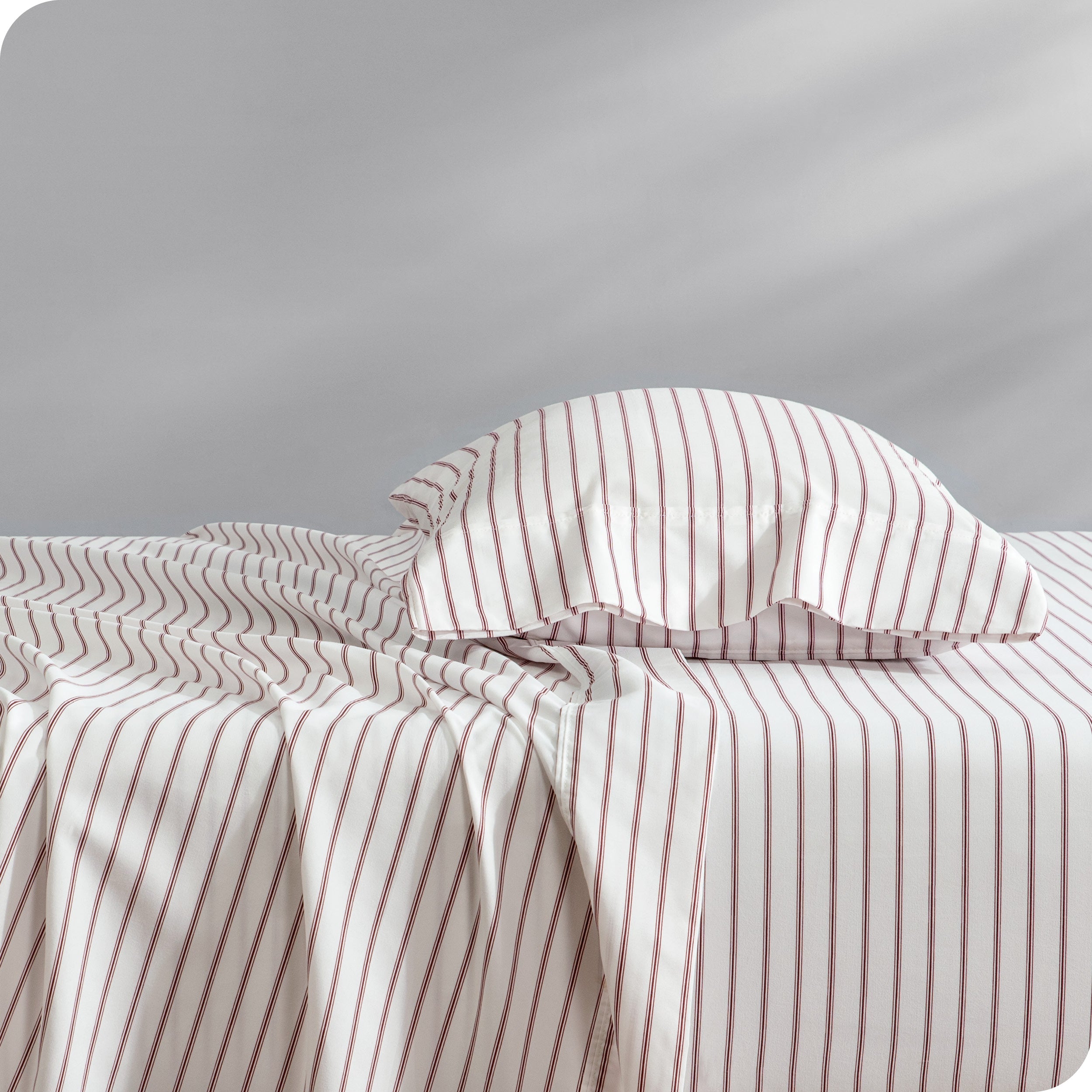 A sideview of a bed with one pillow in our printed microfiber sheet set.