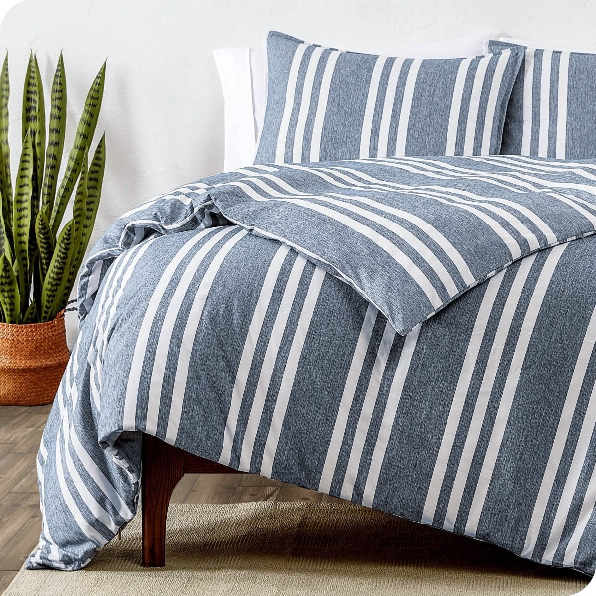 A modern bed with a printed microfiber duvet cover and sham set.