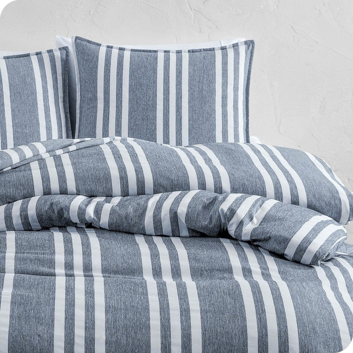 A modern bed with a printed microfiber duvet cover and sham set.