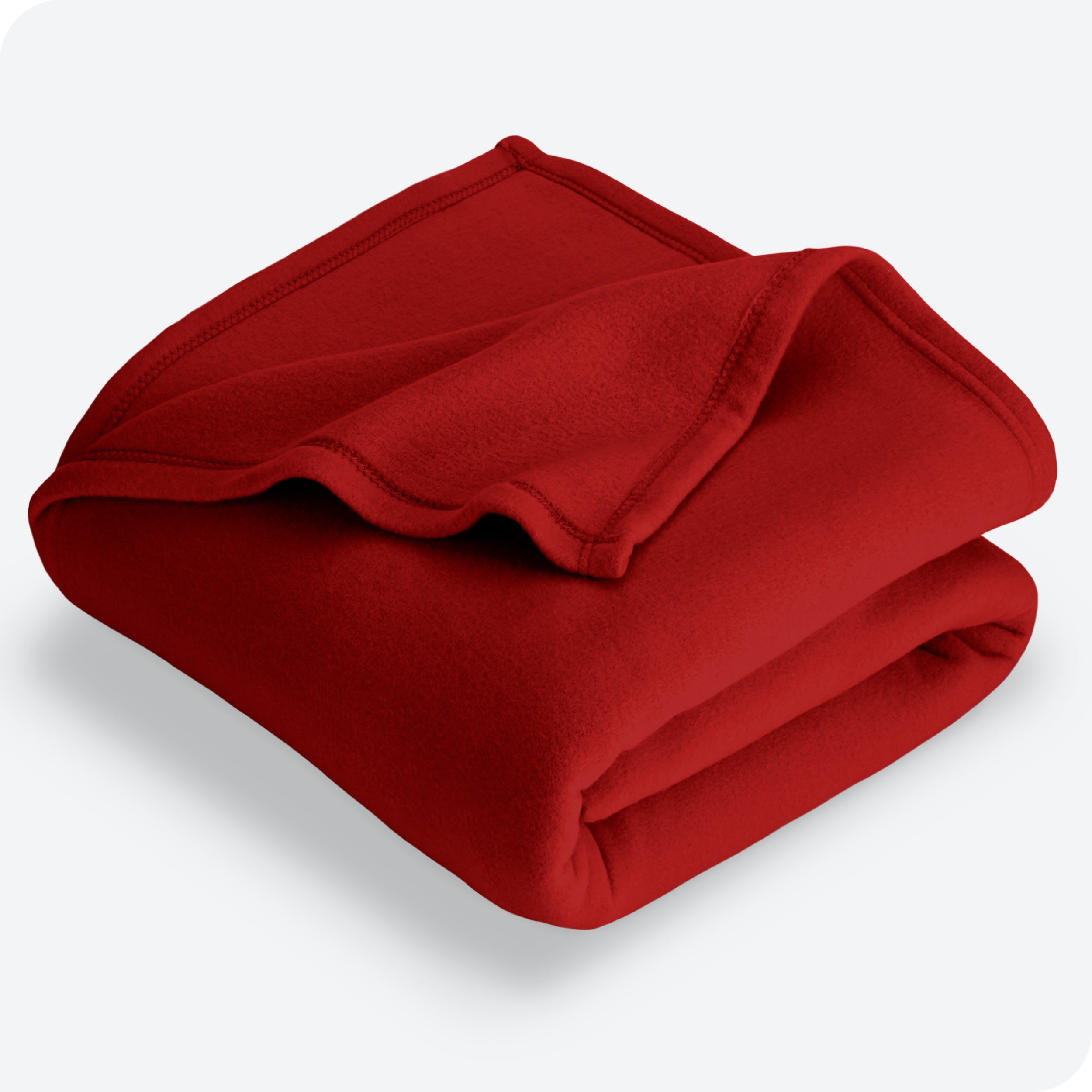 Red polar fleece blanket folded with 1 corner folded back