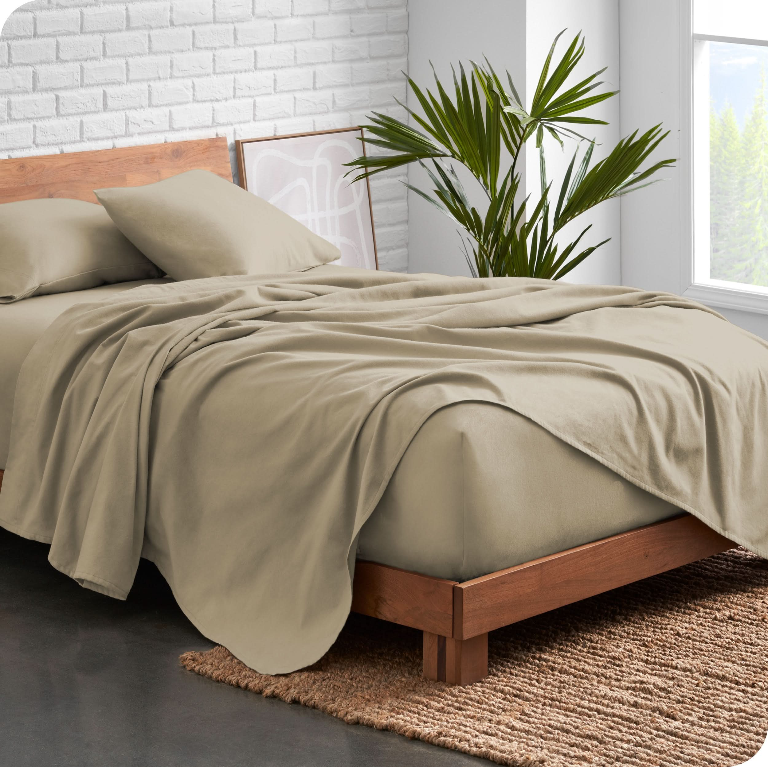 Modern wood bed frame with sand organic flannel sheets and pillowcases