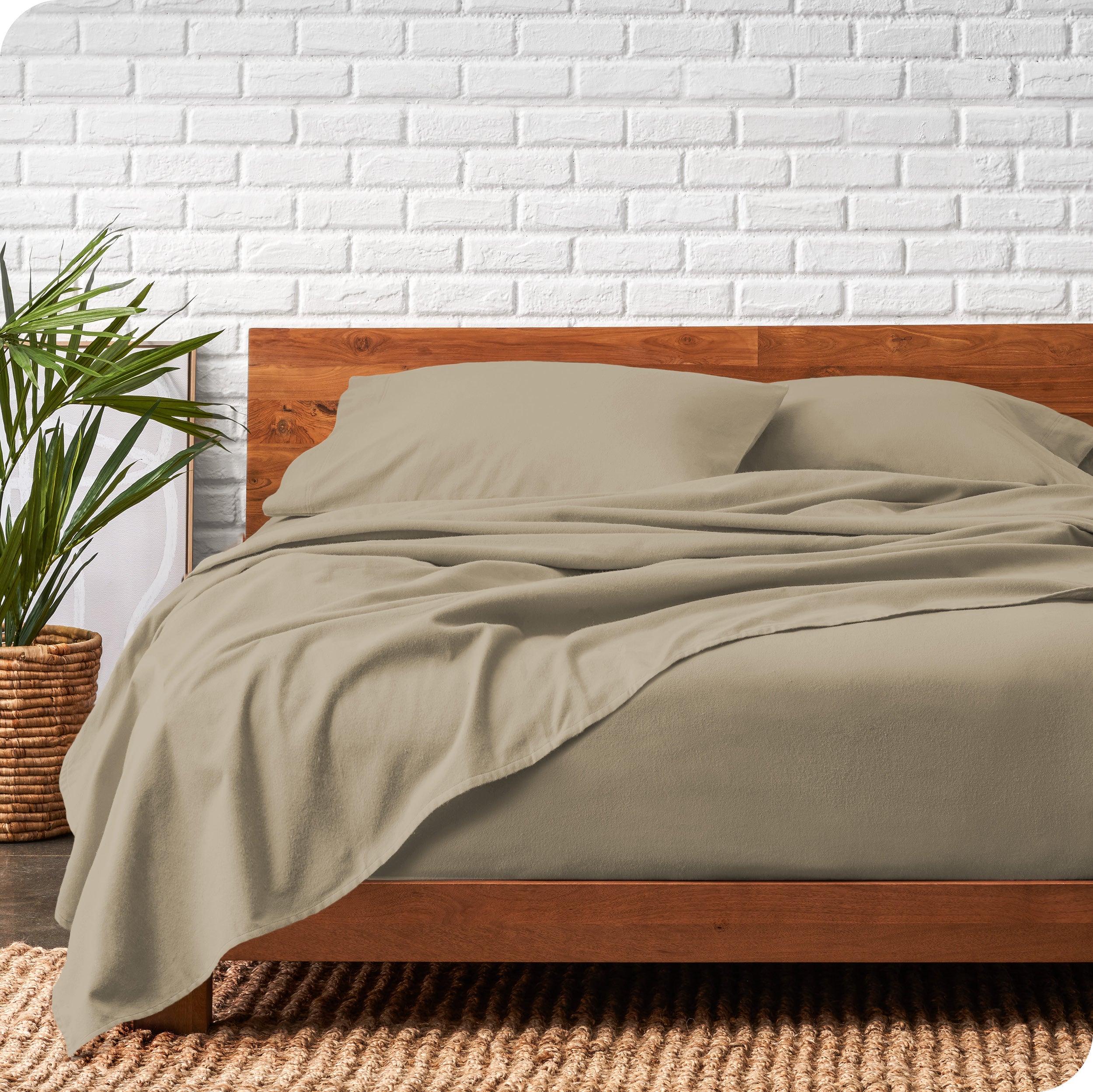 Modern wood bed frame with sand organic flannel sheets and pillowcases