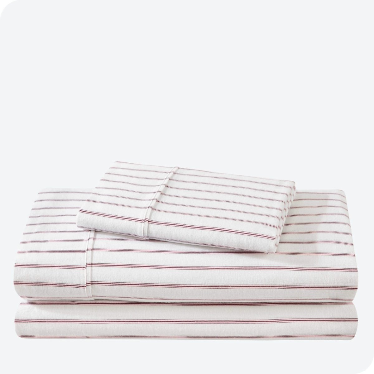 Flannel print sheet set folded and stacked neatly on a white background