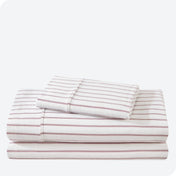 Flannel print sheet set folded and stacked neatly on a white background