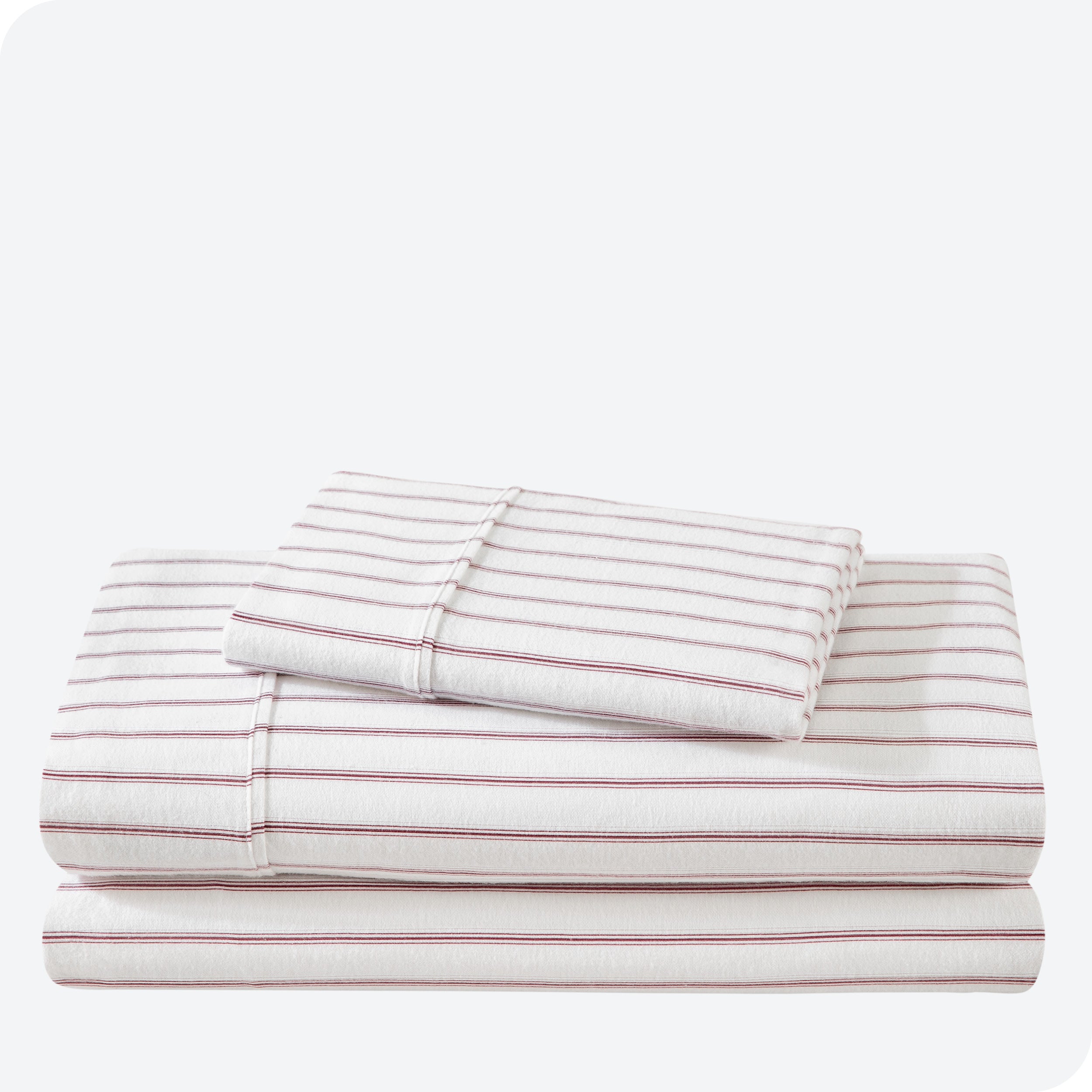 Flannel print sheet set folded and stacked neatly on a white background