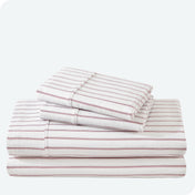 Flannel print sheet set folded and stacked neatly on a white background