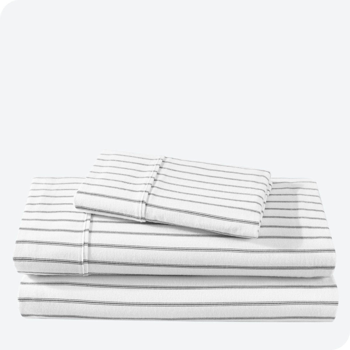 Flannel print sheet set folded and stacked neatly on a white background