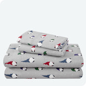 Flannel print sheet set folded and stacked neatly on a white background