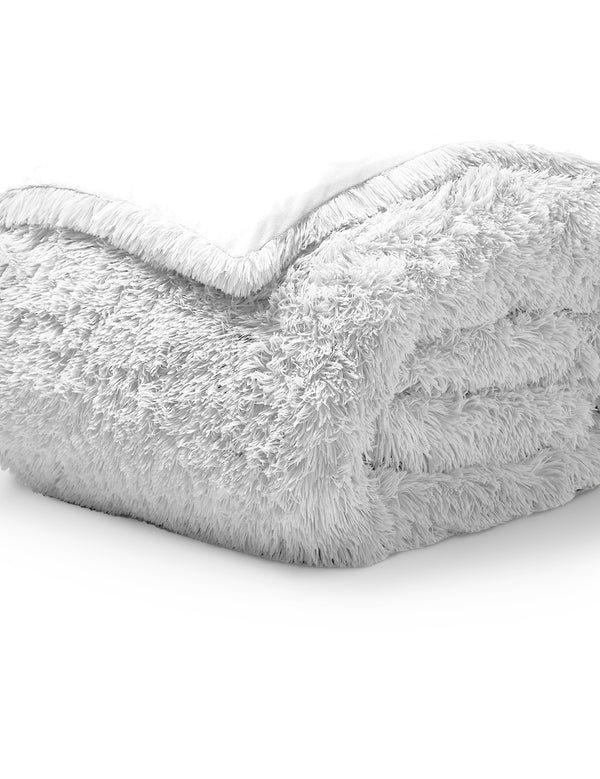 A white shaggy duvet cover folded neatly