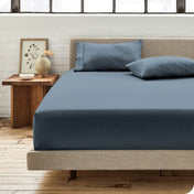 Modern bedroom with bed showing bering sea percale fitted sheet